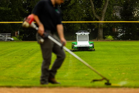 Autonomous commercial robotic mower background athletic field crew edging 